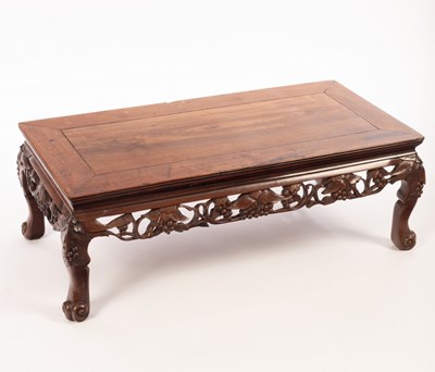 Lot 557 - A Chinese Kang table, 19th/20th Century,...