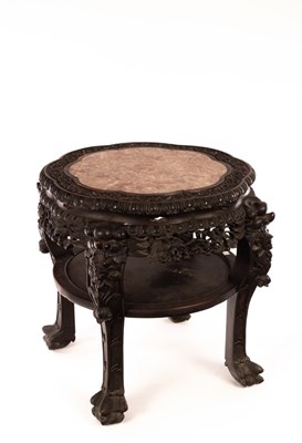 Lot 560 - A Chinese hardwood carved stool , 20th Century,...