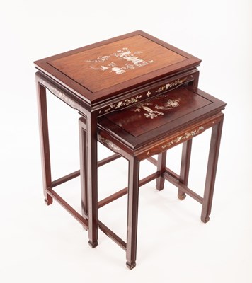 Lot 561 - A nest of two Chinese mahogany tables, 20th...