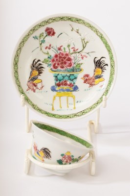 Lot 576 - A Chinese famille rose teacup and saucer set,...