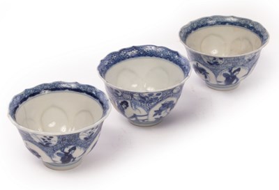 Lot 644 - A set of three blue and white tea bowls, Qing...