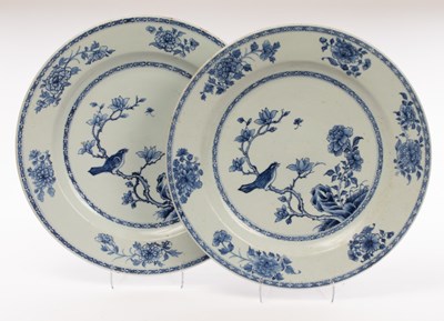 Lot 646 - A large pair of blue and white circular dishes,...