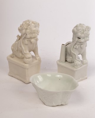 Lot 669 - A near pair of Foo dogs 19th/20th Century,...