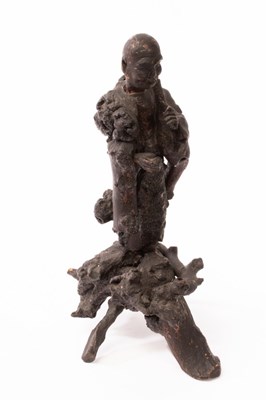 Lot 689 - A Chinese root carving of a Buddhism Luohan,...