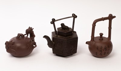 Lot 694 - Three Chinese Zisha teapots, 20th Century,...