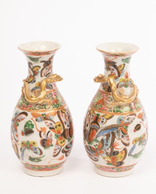 Lot 704 - A pair of Chinese famille rose export vases,...