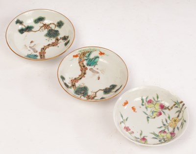 Lot 715 - A pair of Chinese famille rose saucers,...