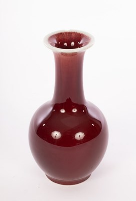 Lot 751 - A Chinese red monochrome vase, 20th Century,...