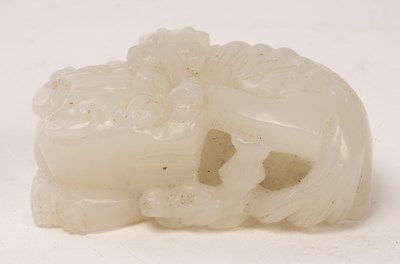 Lot 758 - A Chinese white jade carved beast Pixiu,...