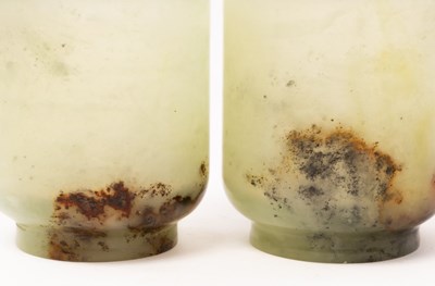 Lot 764 - A pair of Chinese celadon jade tea cups,...