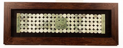 Lot 769 - A large banner of jade roundels in a wooden...