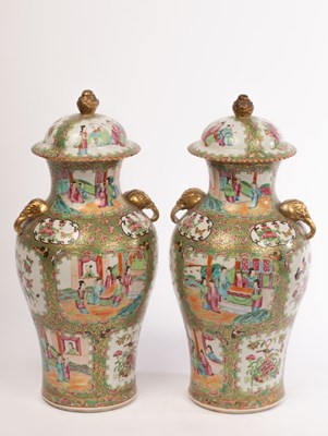 Lot 792 - A pair of Chinese export famille rose vases...