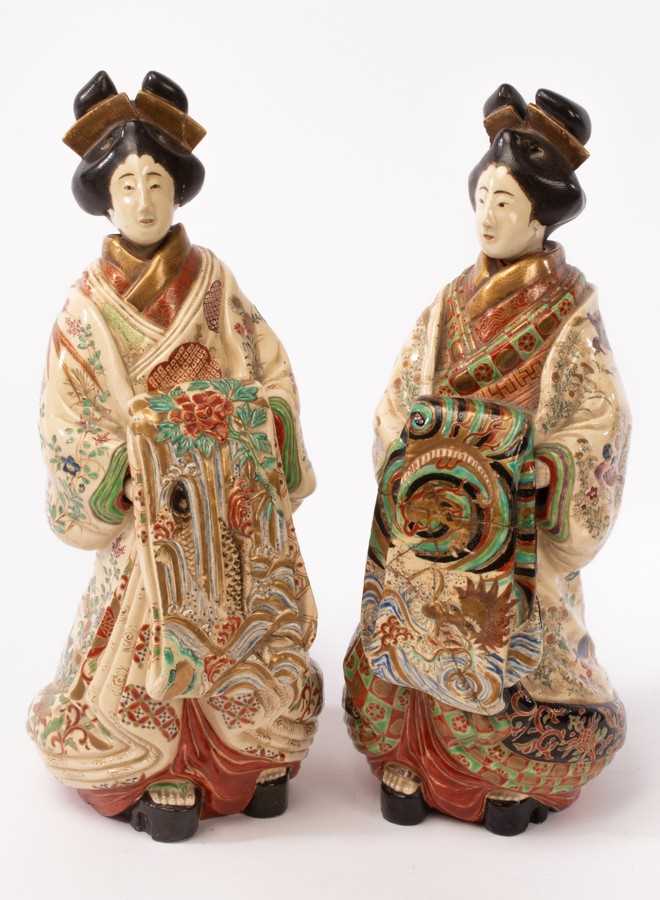 Lot 794 - A pair of Japanese figural flasks modeled as
