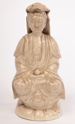 Lot 801 - A Chinese monochrome glazed porcelain figure...