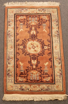 Lot 861 - A Chinese superwash rug, the peach field with...