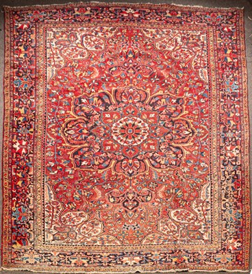 Lot 905 - A Heriz carpet, North West Persia, the madder...