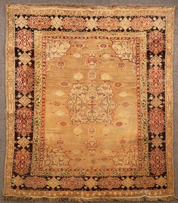 Lot 934 - A small Agra carpet, the camel field centred...