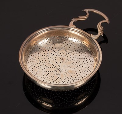 Lot 37 - A George III silver strainer, London 1762,...