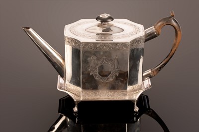 Lot 64 - A George III silver teapot and stand, John...