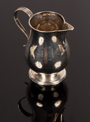 Lot 102 - A George II silver jug, makers mark only,...