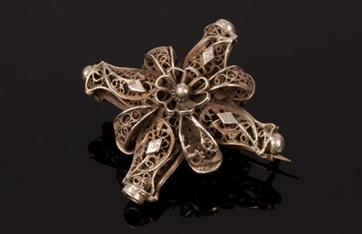 Lot 174 - An Eastern white metal brooch of cross form,...