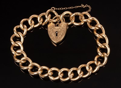 Lot 180 - A 9ct gold curb link bracelet, S & K, with...