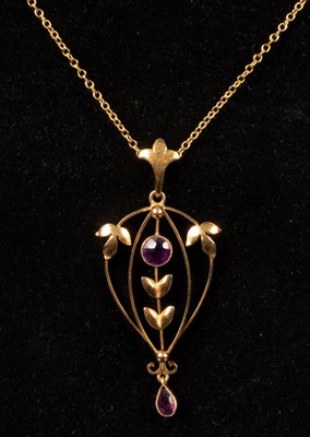 Lot 181 - An Edwardian amethyst pendant necklace in a...