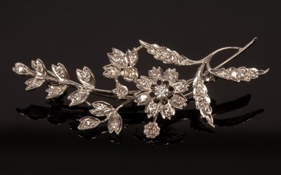 Lot 186 - A diamond flower spray brooch set in 18ct...