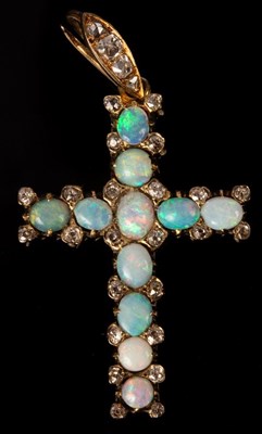 Lot 188 - An opal and diamond set cross in an...