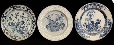 Lot 383 - Two English blue and white Delftware chargers...