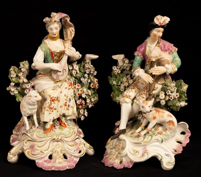 Lot 394 - A pair of Continental porcelain candlestick...