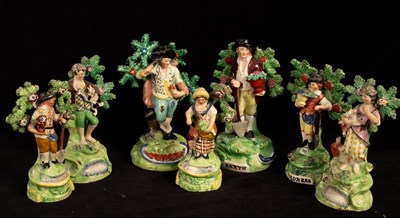 Lot 411 - Seven Staffordshire pearlware bocage figures...