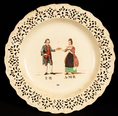 Lot 462 - An English creamware marriage plate, circa...