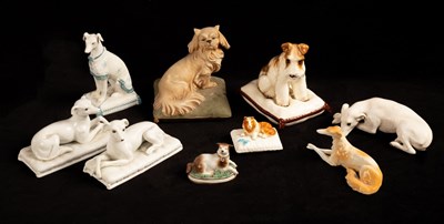 Lot 469 - Nine porcelain models of dogs, 19th and 20th...