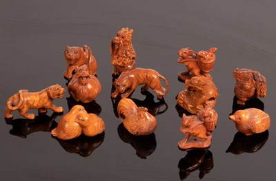 Lot 483 - Twelve Japanese carved boxwood netsuke, 20th...