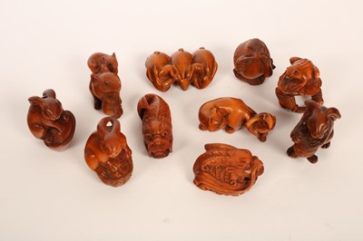 Lot 484 - Ten Japanese carved boxwood netsuke, 20th...