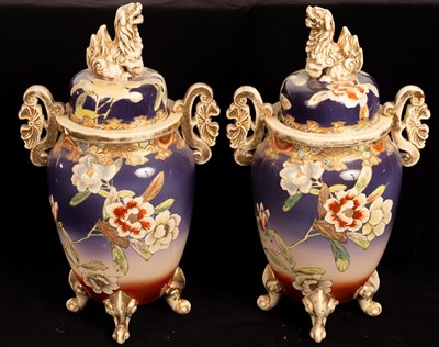 Lot 485 - A pair of Japanese pottery vases, the covers...