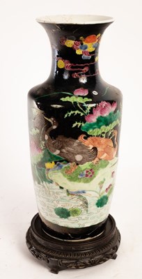 Lot 489 - A Chinese porcelain vase, decorated ducks on a...