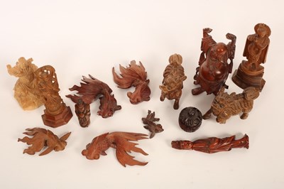 Lot 495 - A quantity of carved wood netsuke and...