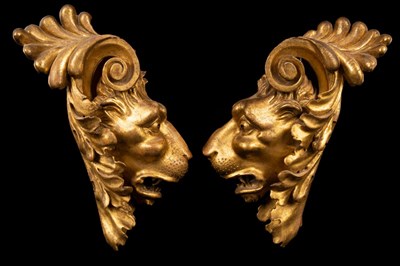 Lot 533 - A pair of carved gilt wood lion masks, 33cm...