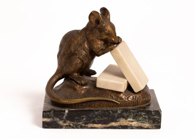 Lot 544 - A bronze figure of a mouse eating pieces of...