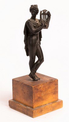 Lot 545 - A bronze figure of a Classical youth playing a...