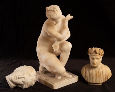 Lot 571 - A Grand Tour alabaster figure of the crouching...