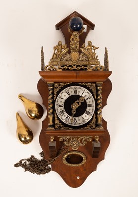 Lot 582 - A reproduction Dutch wall clock with brass...