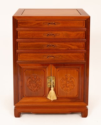 Lot 939 - A Chinese hardwood side cabinet, fitted four...