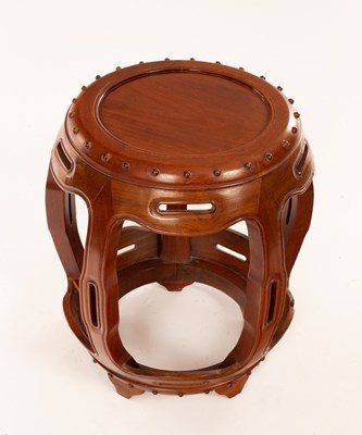 Lot 949 - A Chinese carved hardwood stool, bears label...