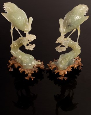 Lot 960 - A pair of Chinese carved jade cranes, 28cm...