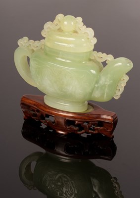 Lot 961 - A Chinese carved jade teapot, 15cm high...