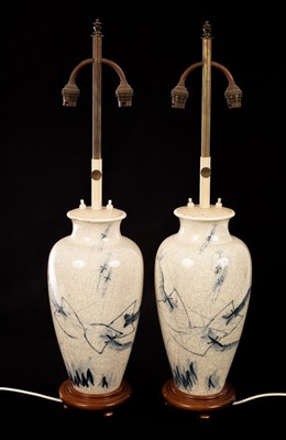 Lot 969 - A pair of Eastern blue and white lamp bases...