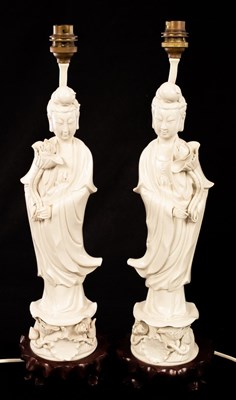 Lot 977 - A pair of blanc de chine figural lamp bases,...